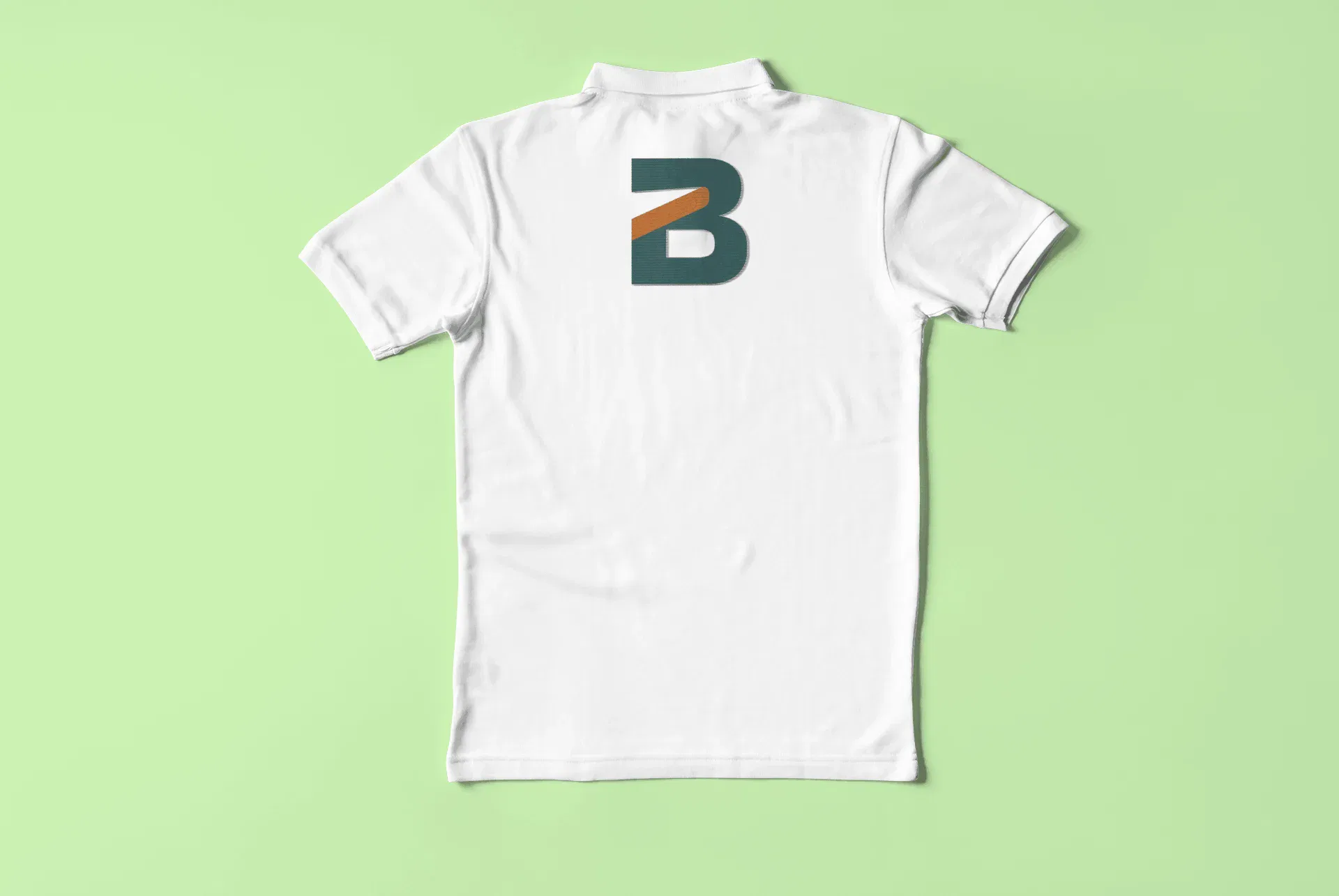 Rear view of a white polo shirt featuring a large teal and orange 
