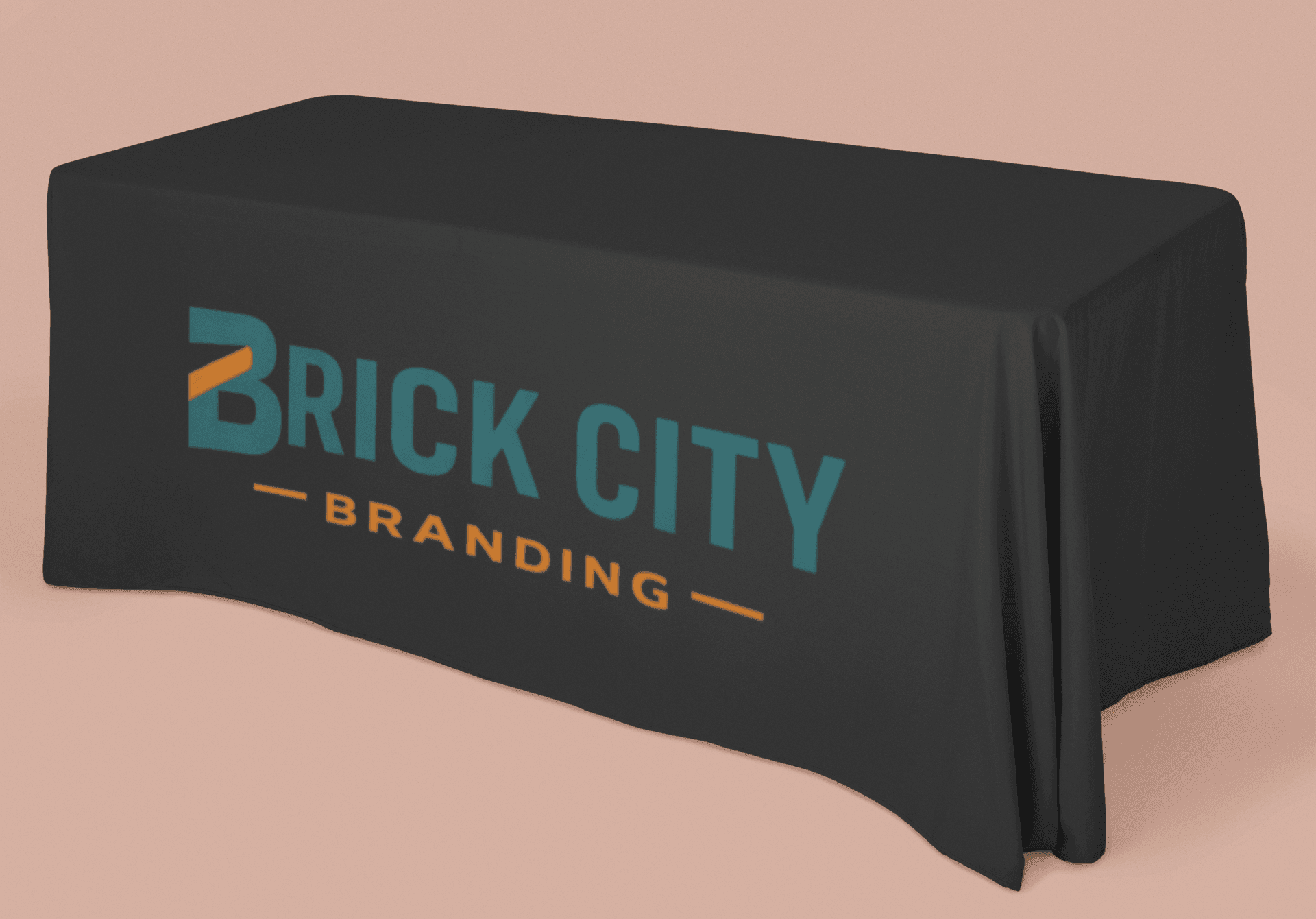 A 6-foot rectangular black custom branded table cloth featuring the Brick City Branding logo in teal and orange on the front drape.