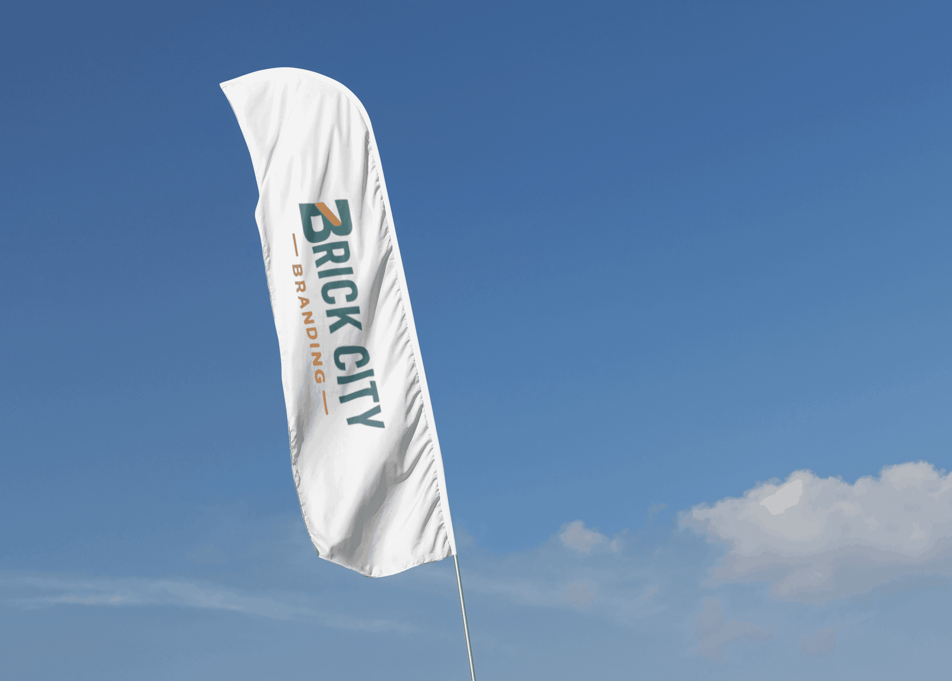 Two large custom feather flags with the Brick City Branding logo in teal and orange, standing outside a modern building on a sunny day.