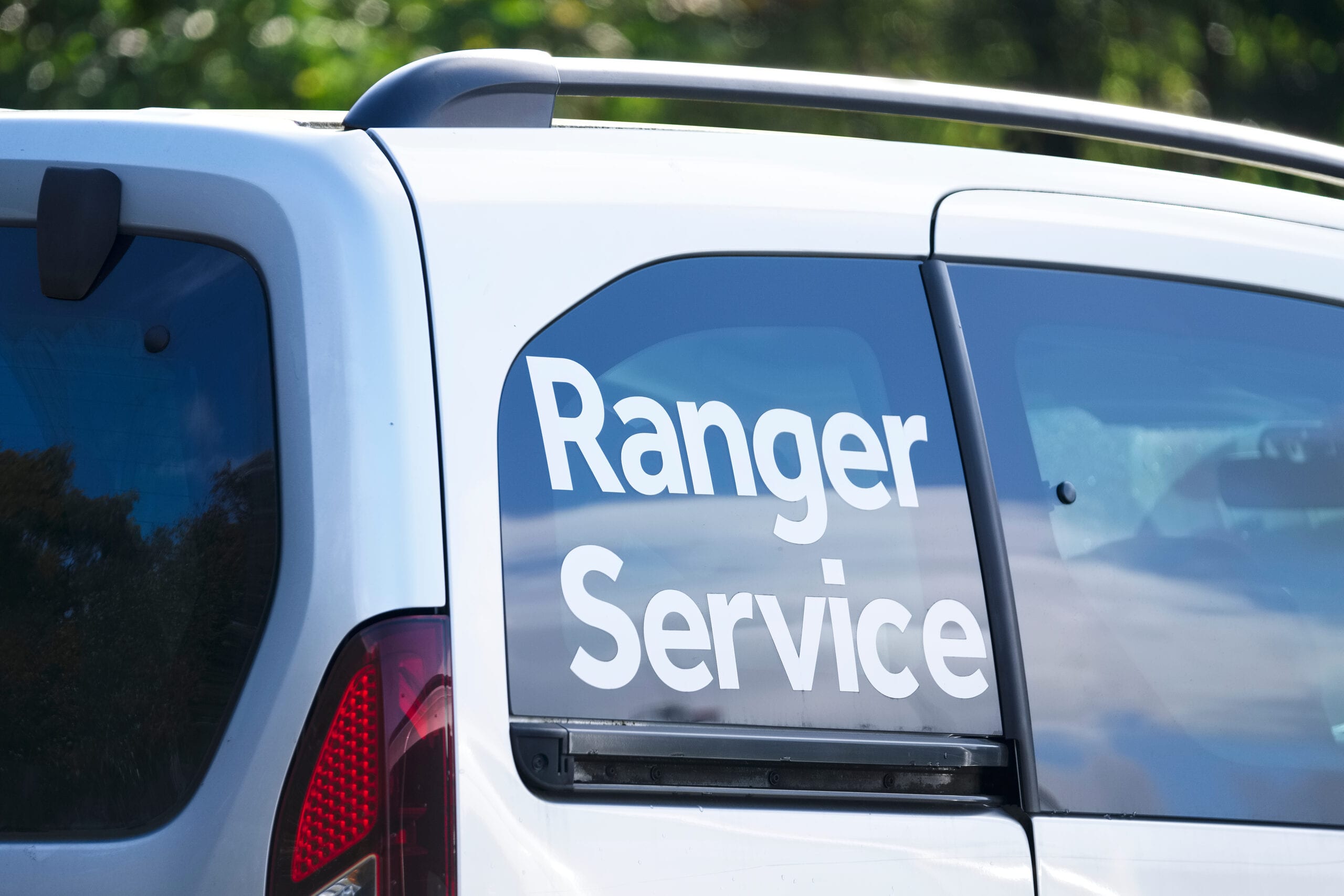 Close-up of a white utility vehicle featuring 