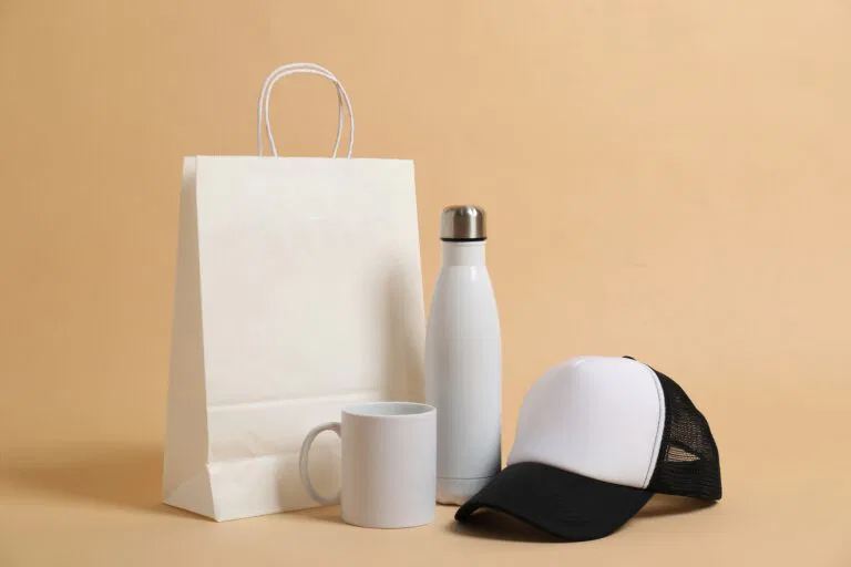 Different blank items for branding on beige background. Mockup for design